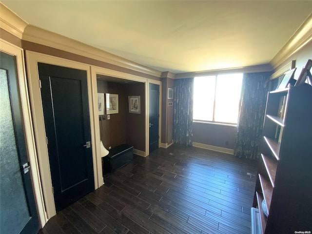 unfurnished room with dark hardwood / wood-style floors and crown molding