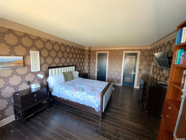 bedroom with dark hardwood / wood-style flooring