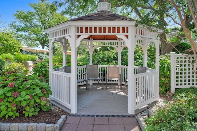 view of property's community with a gazebo and a deck