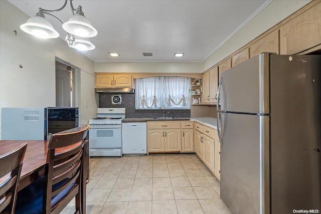 kitchen featuring sink, backsplash, decorative light fixtures, white appliances, and light brown cabinetry