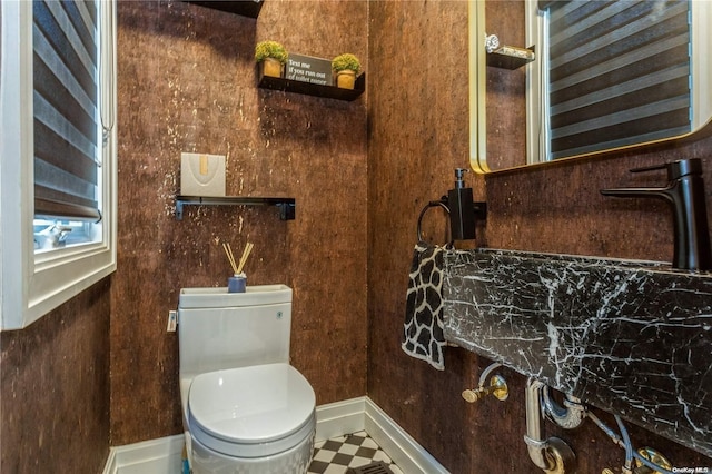 bathroom with tile patterned flooring and toilet