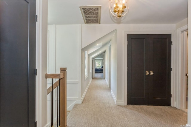 hallway featuring light carpet