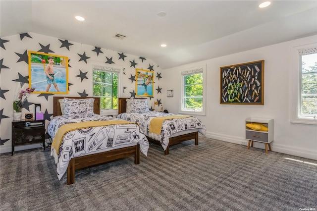 carpeted bedroom featuring multiple windows and vaulted ceiling