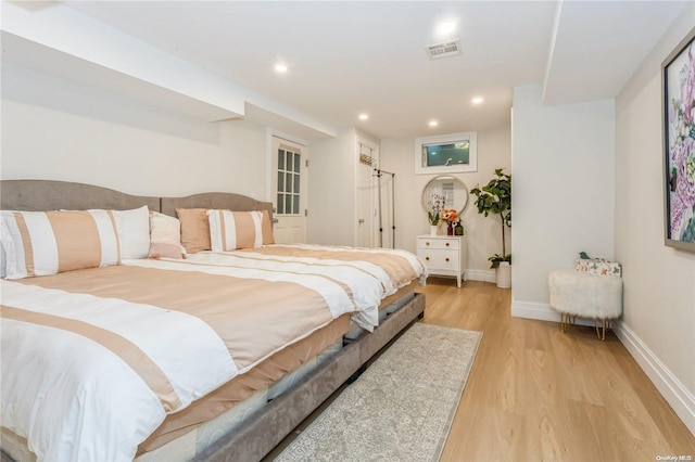 bedroom with light wood-type flooring