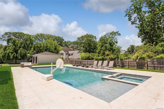 view of swimming pool with an in ground hot tub and a patio