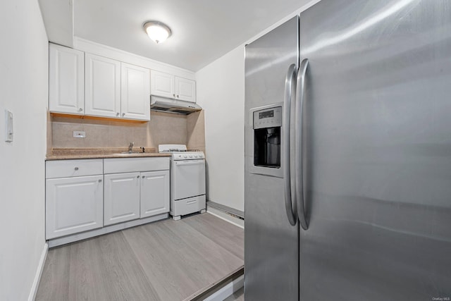 kitchen featuring white cabinets, backsplash, stainless steel fridge with ice dispenser, and white gas stove