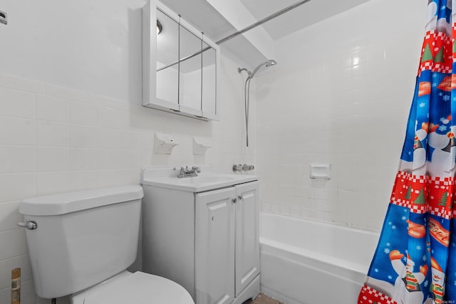 full bathroom featuring tile walls, toilet, vanity, and shower / bath combination with curtain