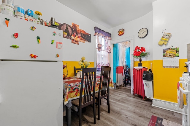 dining area with hardwood / wood-style flooring