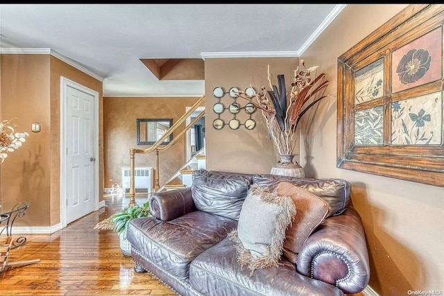 interior space featuring wood-type flooring and ornamental molding