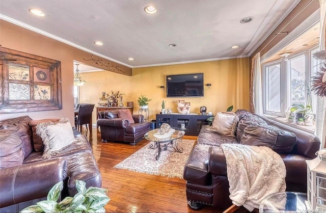 living room featuring hardwood / wood-style floors and ornamental molding