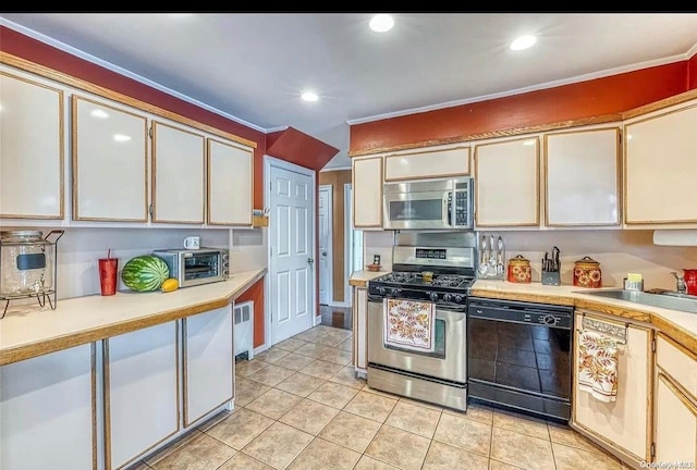 kitchen featuring crown molding, sink, light tile patterned floors, and stainless steel appliances