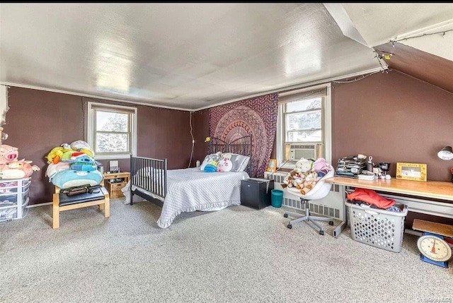 carpeted bedroom with radiator, vaulted ceiling, multiple windows, and cooling unit