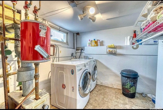 clothes washing area featuring independent washer and dryer