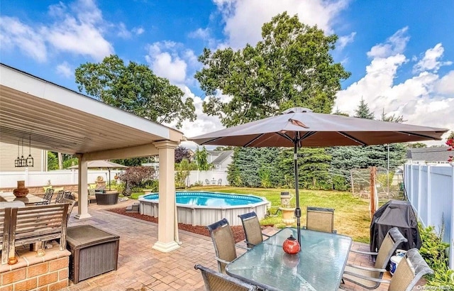 view of patio / terrace with a fenced in pool