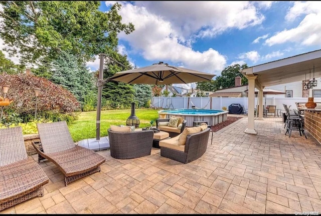 view of patio / terrace featuring a fenced in pool and an outdoor living space