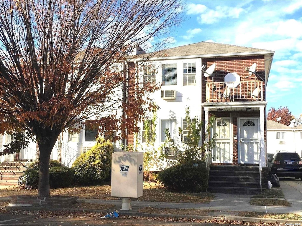 view of front of home with a balcony