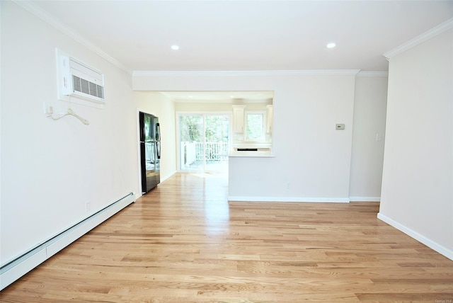 empty room featuring a baseboard radiator, a wall unit AC, light wood finished floors, ornamental molding, and baseboards