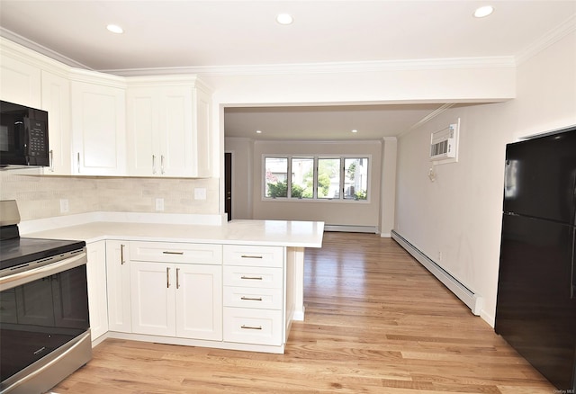 kitchen with black appliances, baseboard heating, crown molding, light countertops, and white cabinetry