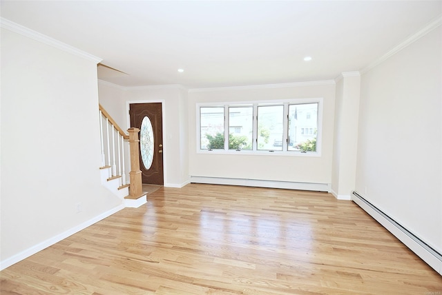 foyer featuring a baseboard heating unit, light wood-style flooring, ornamental molding, stairs, and baseboards