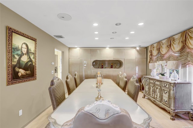 dining area with light hardwood / wood-style floors