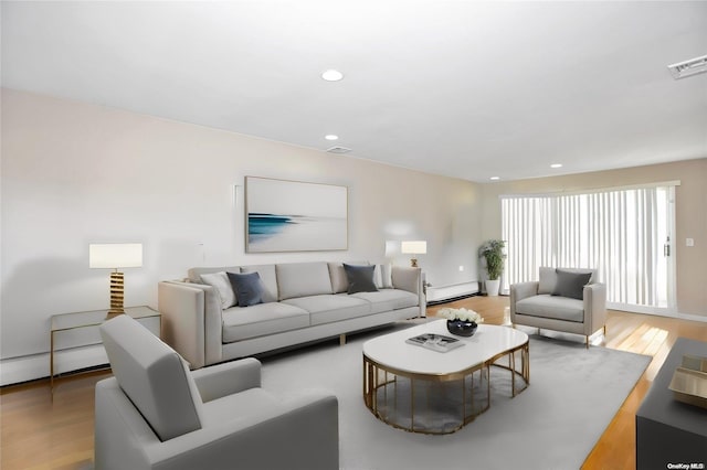 living room with wood-type flooring and baseboard heating