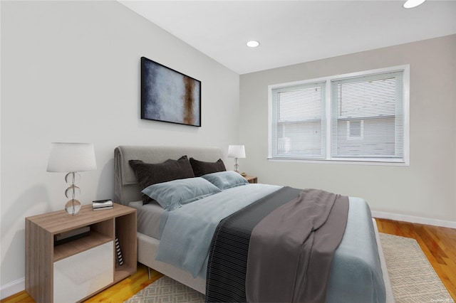 bedroom with light hardwood / wood-style floors