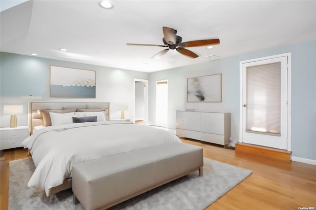 bedroom featuring ceiling fan and light hardwood / wood-style floors