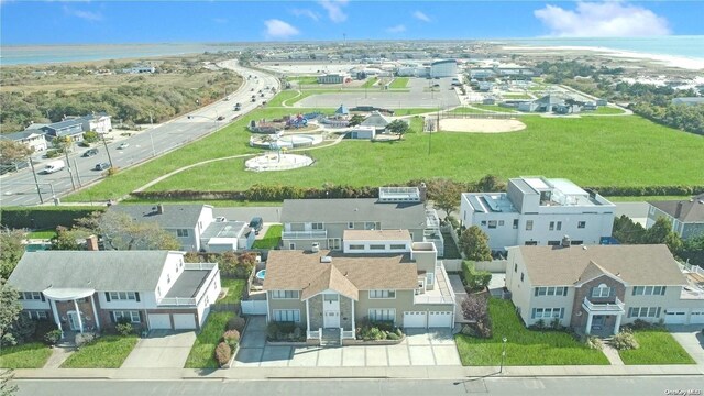 aerial perspective of suburban area featuring a nearby body of water