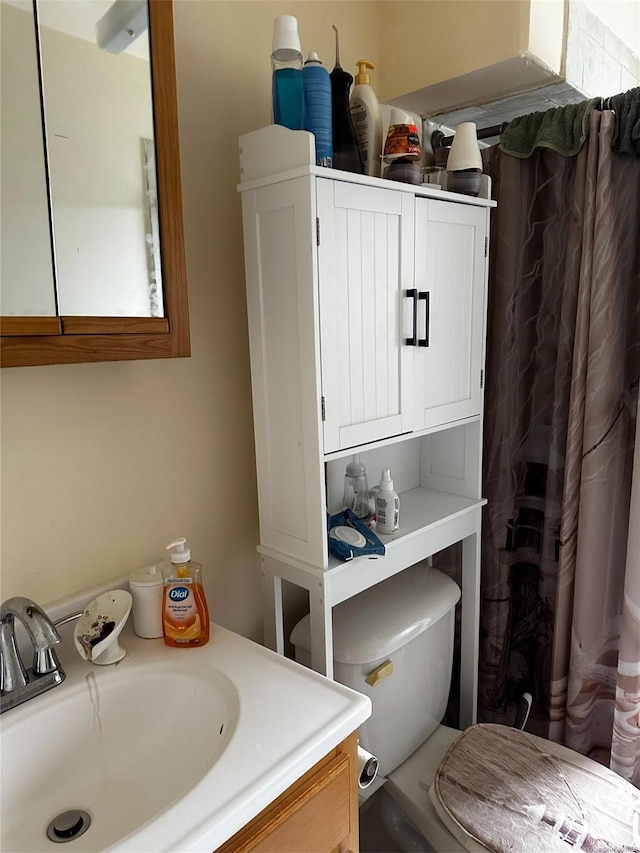 bathroom with vanity and toilet