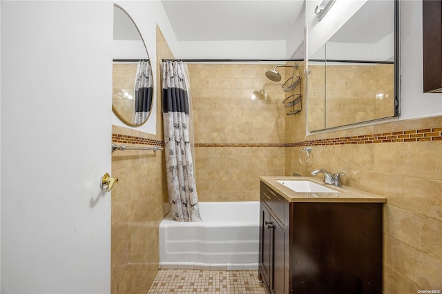 bathroom with tile patterned floors, vanity, tile walls, and shower / tub combo with curtain