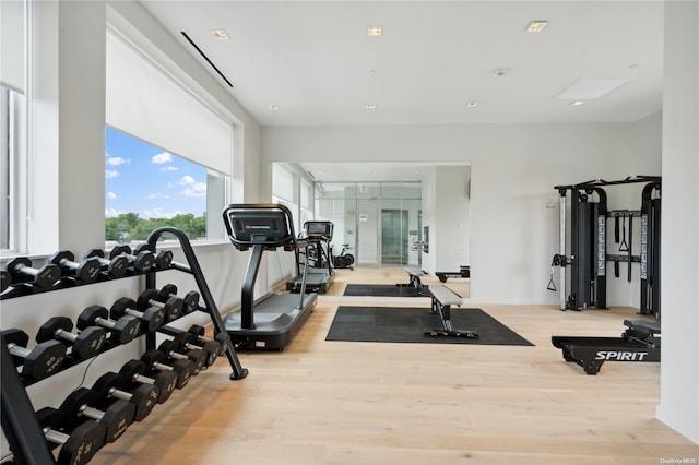 workout area with light wood-type flooring