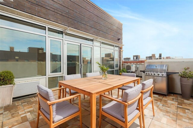 95-08 65th Rd Unit 7A, Rego Park, NY 11374 - view of patio with outdoor dining space and a grill