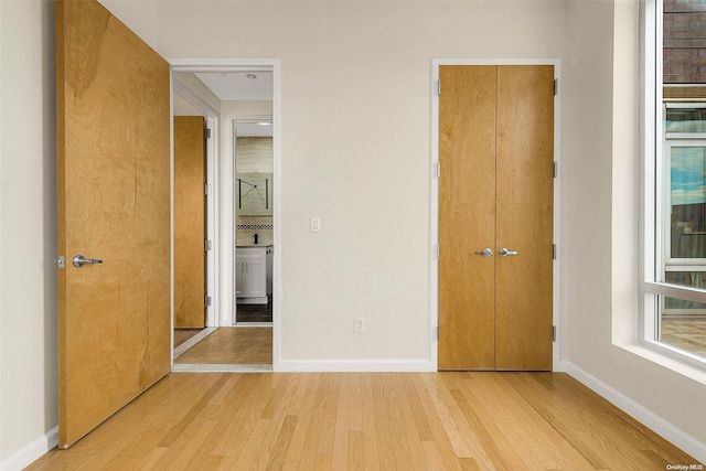 unfurnished bedroom featuring light hardwood / wood-style flooring