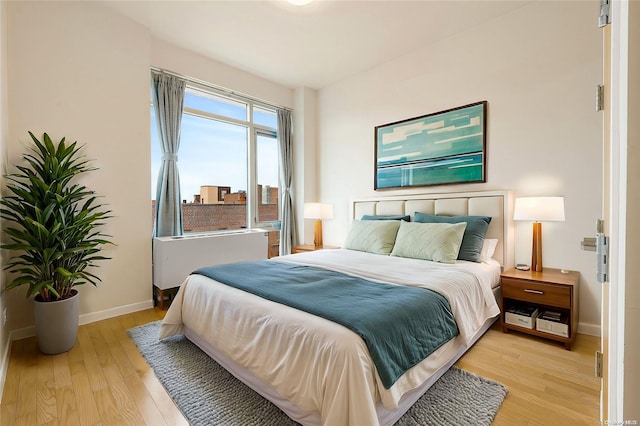 95-08 65th Rd Unit 7A, Rego Park, NY 11374 - bedroom featuring light wood-type flooring and baseboards
