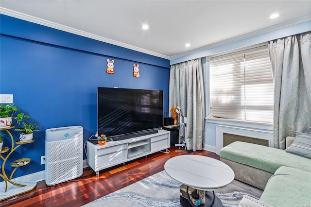 living room featuring crown molding and hardwood / wood-style flooring