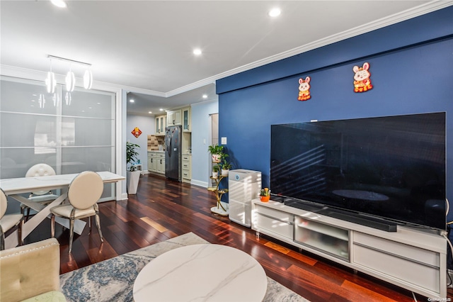 living room featuring dark hardwood / wood-style floors and crown molding