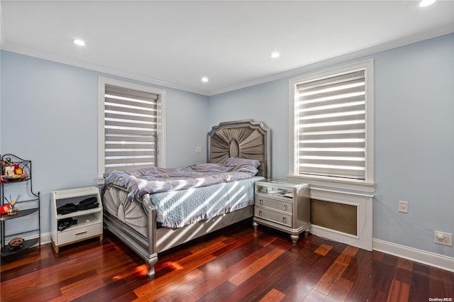 bedroom with dark hardwood / wood-style floors and crown molding