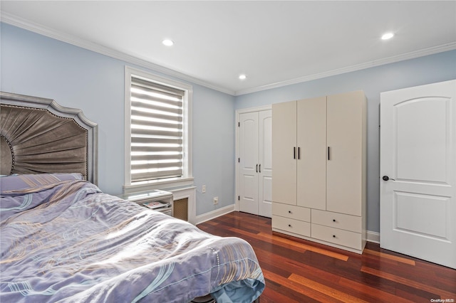 bedroom with dark hardwood / wood-style floors and crown molding