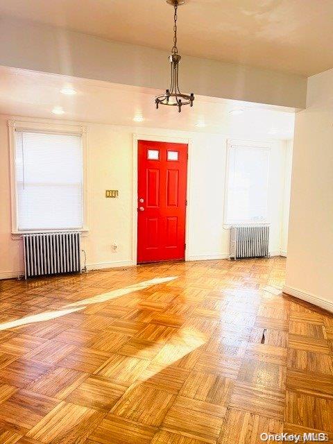 entrance foyer featuring radiator