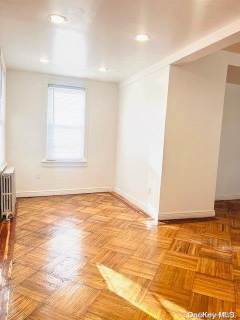 empty room featuring radiator heating unit