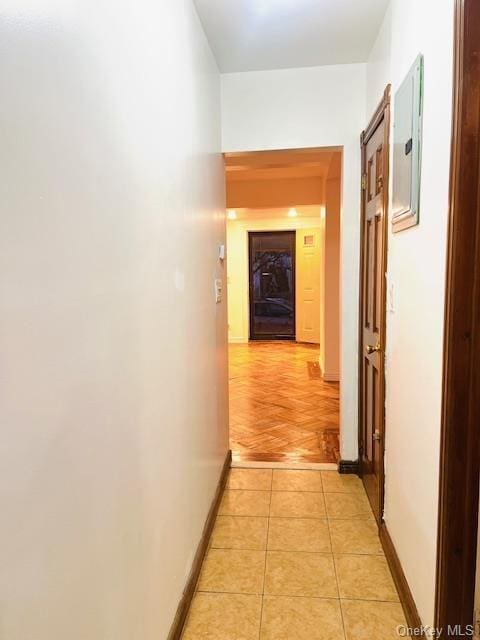 hall featuring electric panel and light parquet flooring