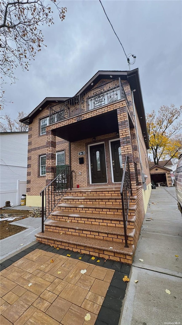 view of front of home with a balcony