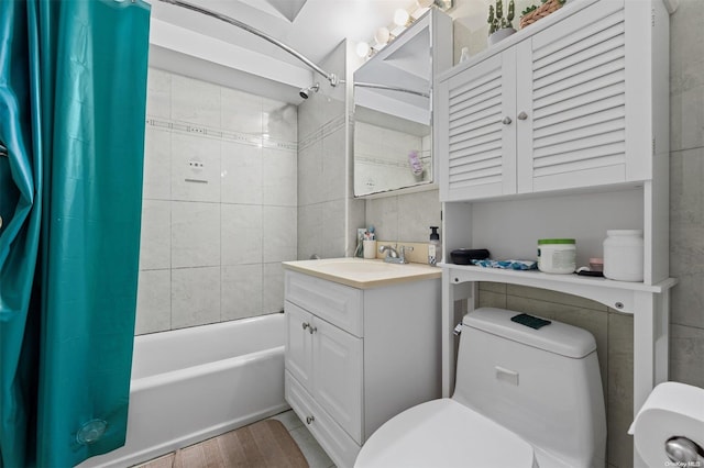 full bathroom featuring hardwood / wood-style flooring, vanity, toilet, and shower / tub combo with curtain