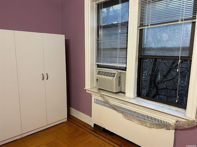 interior space featuring cooling unit and parquet floors