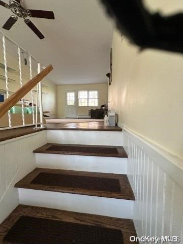 staircase with ceiling fan