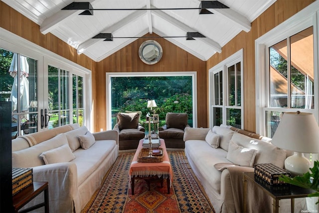 sunroom / solarium with vaulted ceiling with beams and ceiling fan