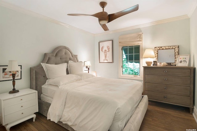 bedroom featuring dark hardwood / wood-style floors, ceiling fan, and ornamental molding