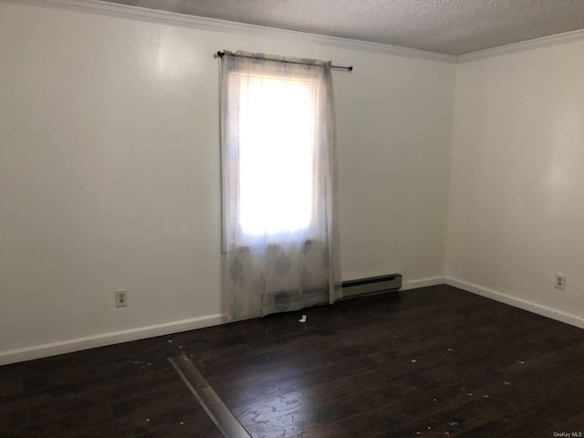 empty room featuring ornamental molding, plenty of natural light, and dark hardwood / wood-style floors