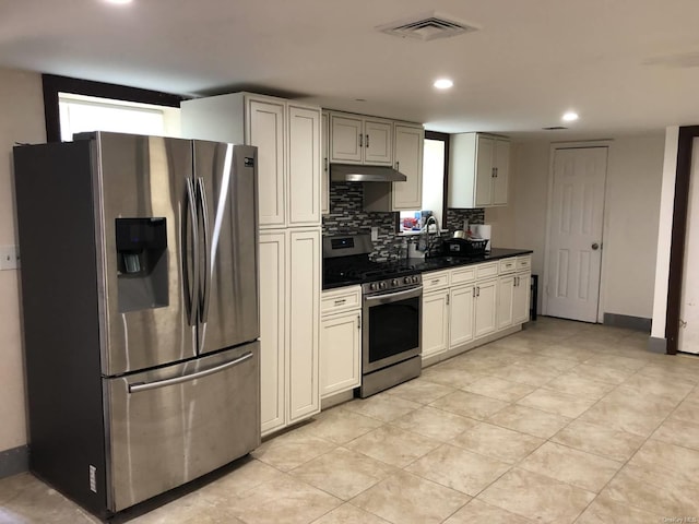 kitchen with tasteful backsplash, sink, a healthy amount of sunlight, and appliances with stainless steel finishes