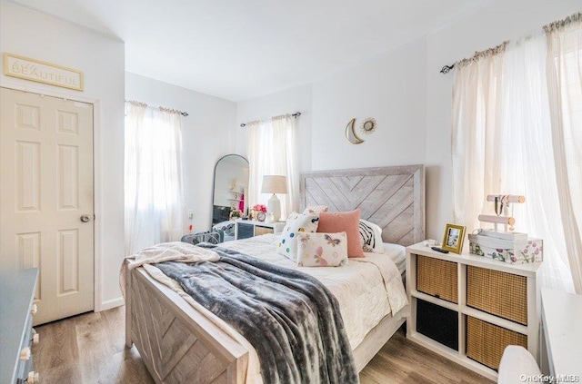 bedroom with light hardwood / wood-style floors